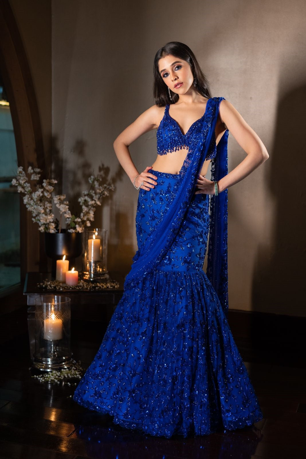 dark blue indian wedding dress Drape yourself in the elegance of midnight with our Royal Blue Lehenga. Featuring an alluring deep blue hue and delicate silver-white embroidery, it's perfect for sangeet nights, receptions, or any moment that